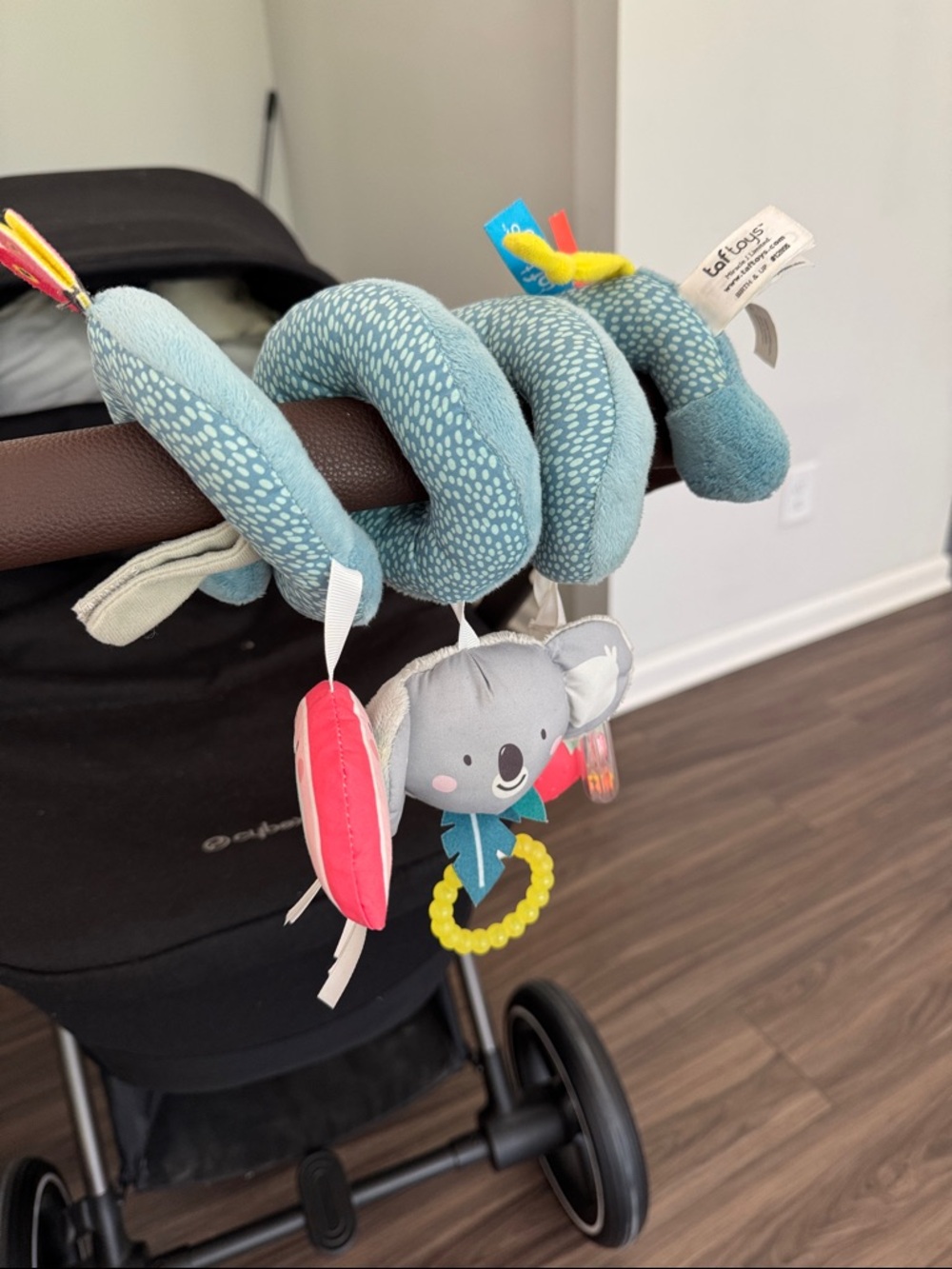 Taft Toys Plush Spiral Stroller Toy in Blue with Yellow and Pink Accents